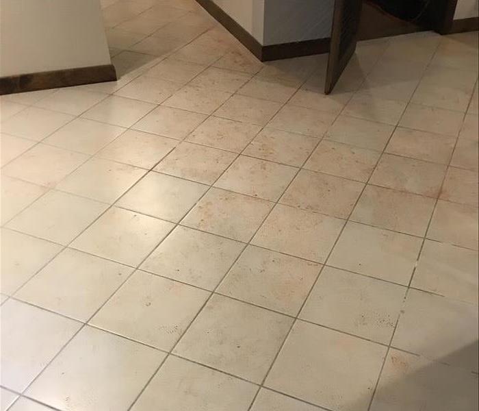 tile floor in basement dirty from water damage