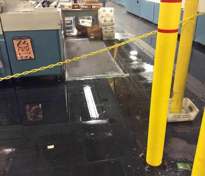 before: standing water throughout a local business' main room from heavy rains